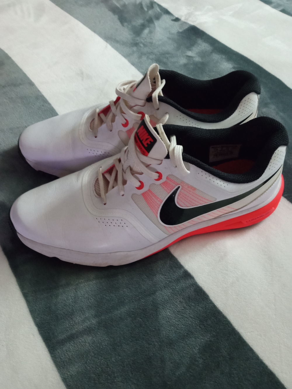 Nike White Golf Sneakers with Black Swoosh and Coral Accents